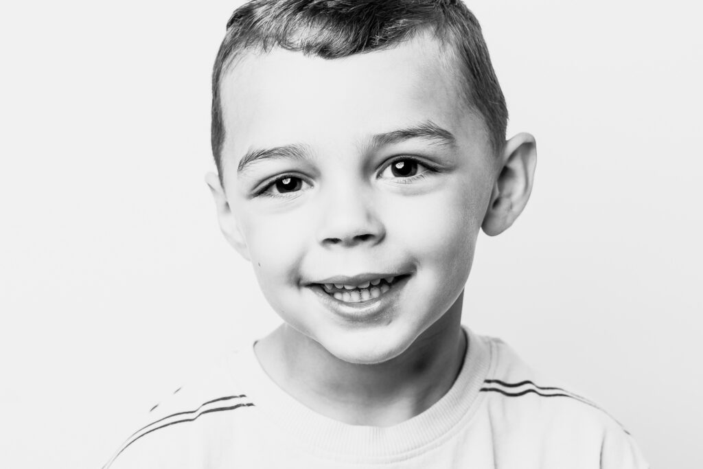 Black and white personality portrait of a child photographed in Cleveland